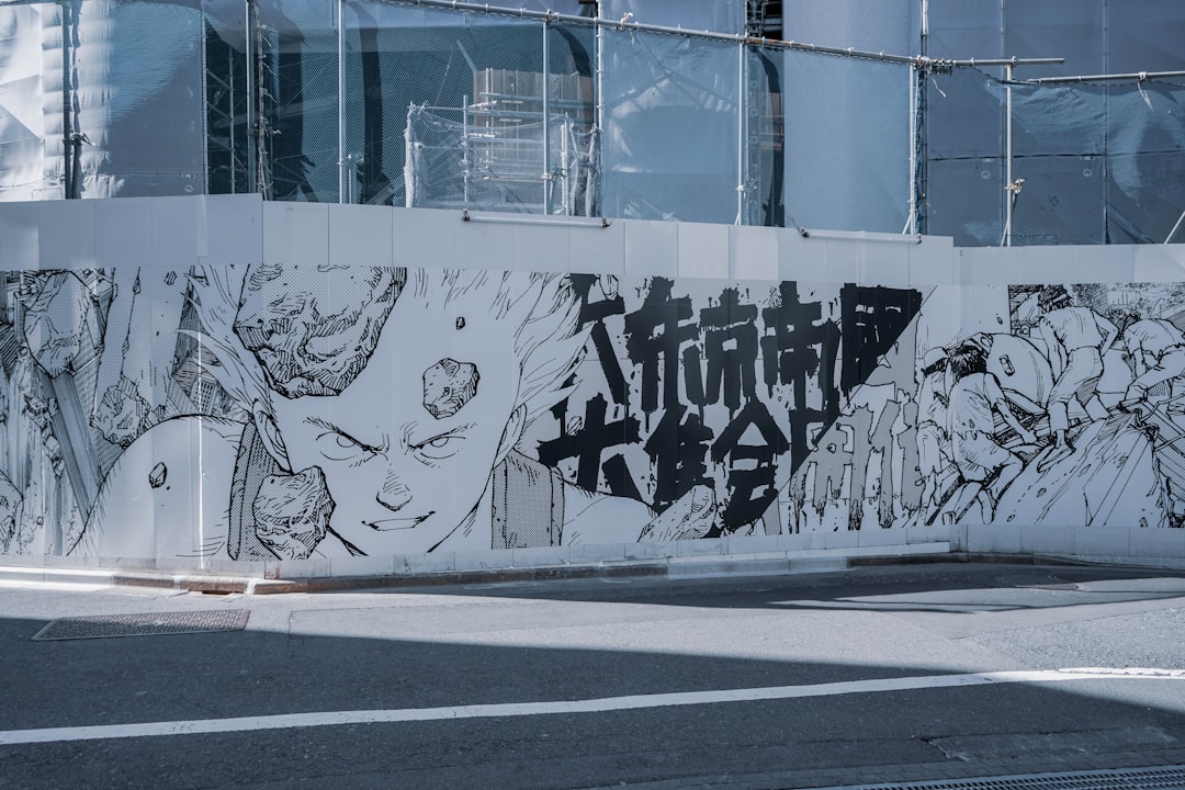 white-and-black-graffiti-on-white-wall-s9esrufnkdg